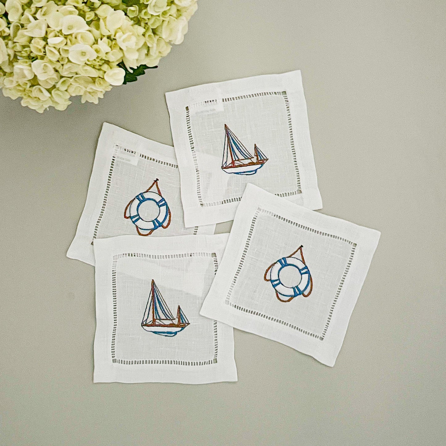 Embroidered linen coasters, set of 4